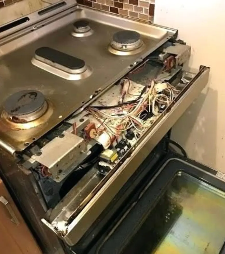 Gas stove opened for ignition and internal component inspection
